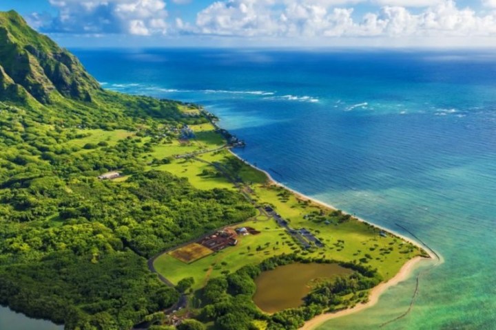 a view of a large body of water with a mountain in the background